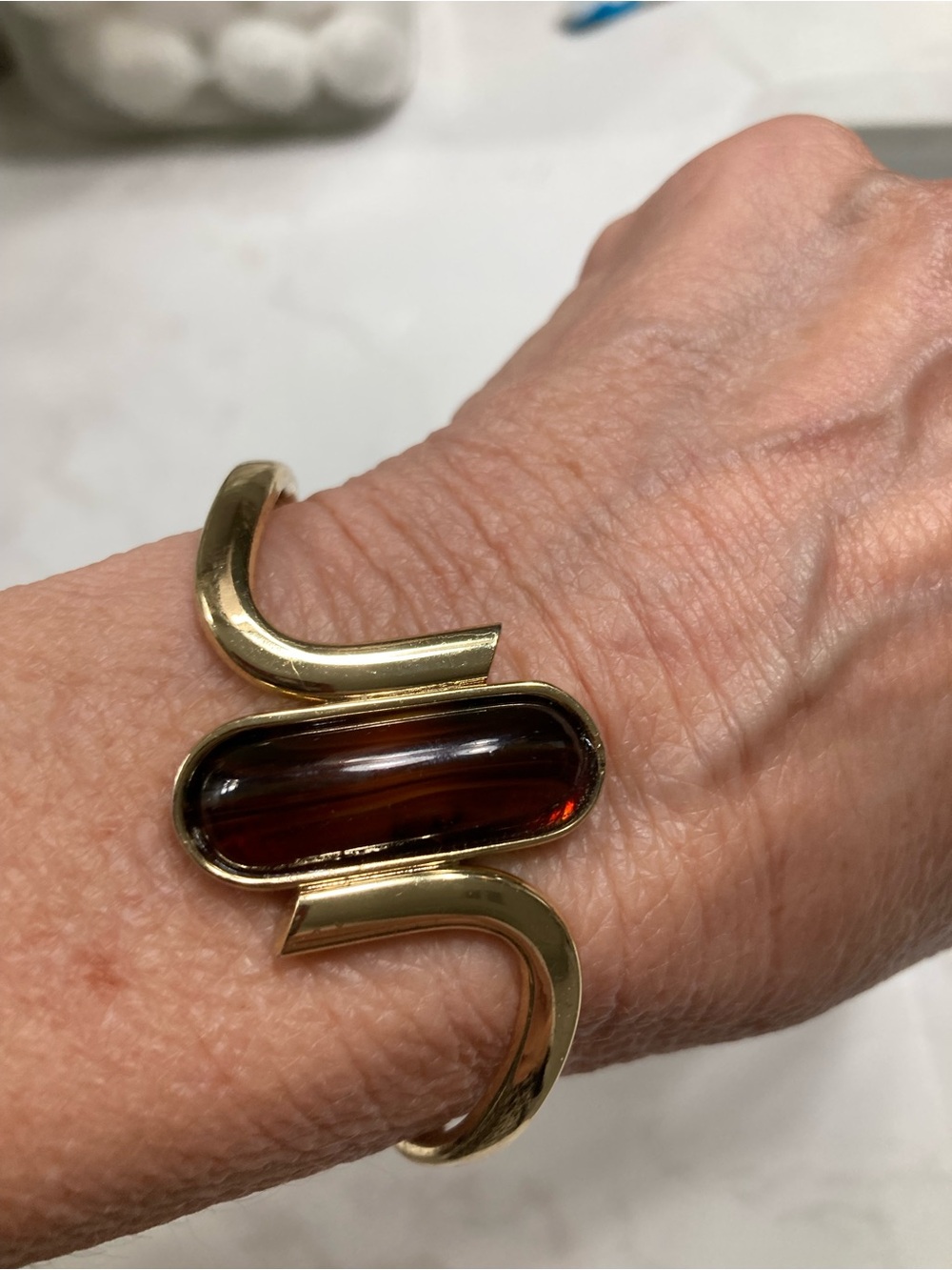 Gold-Tone Cuff Bracelet with Deep Amber Glass Center